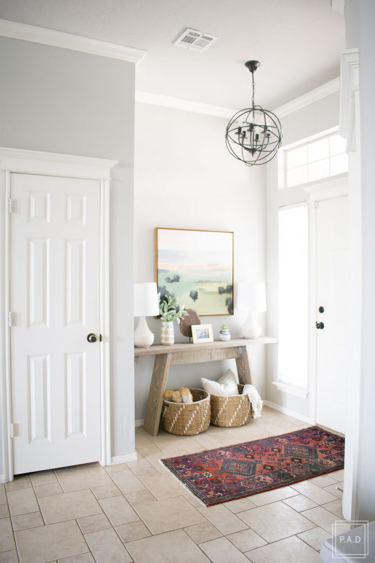 Have you ever finished hanging artwork and realized something just wasn't right? Learn how to hang artwork the right way and create a well styled home with these easy tips that will have you hanging art like a pro!
