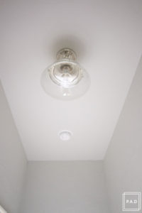 A quick and easy hallway makeover: see how we took this dark hallway from drab to fab!