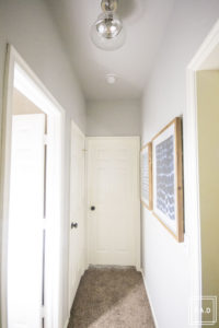 A quick and easy hallway makeover: see how we took this dark hallway from drab to fab!