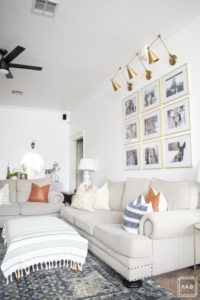 breath of fresh air spring home tour: neutral modern farmhouse/California cool living room with pops of warm leather and blue.