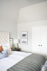 breath of fresh air spring home tour: California cool master bedroom complete with a tufted grand headboard, pattern mixed pillows and tribal rug.