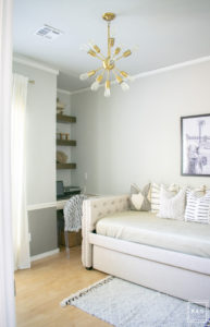 breath of fresh air spring home tour: This office turned guest room is so fun with the framed camel print by Taylor Routt and the fun hats used as wall decor.