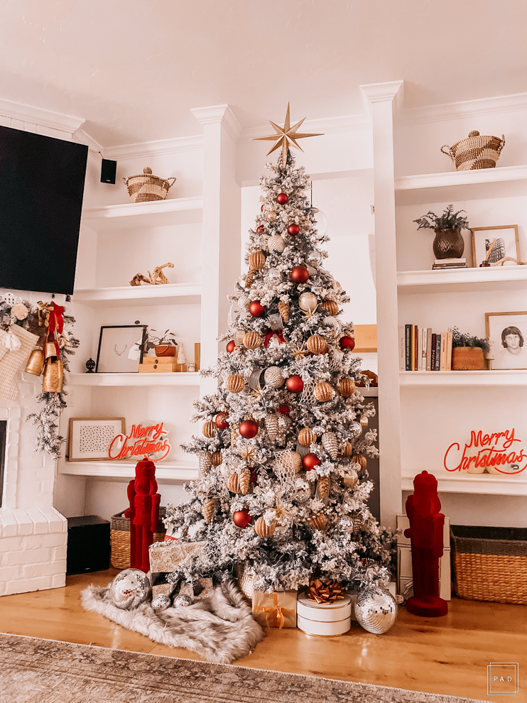 A Modern Christmas living room Decorated with a red neon Merry Christmas sign