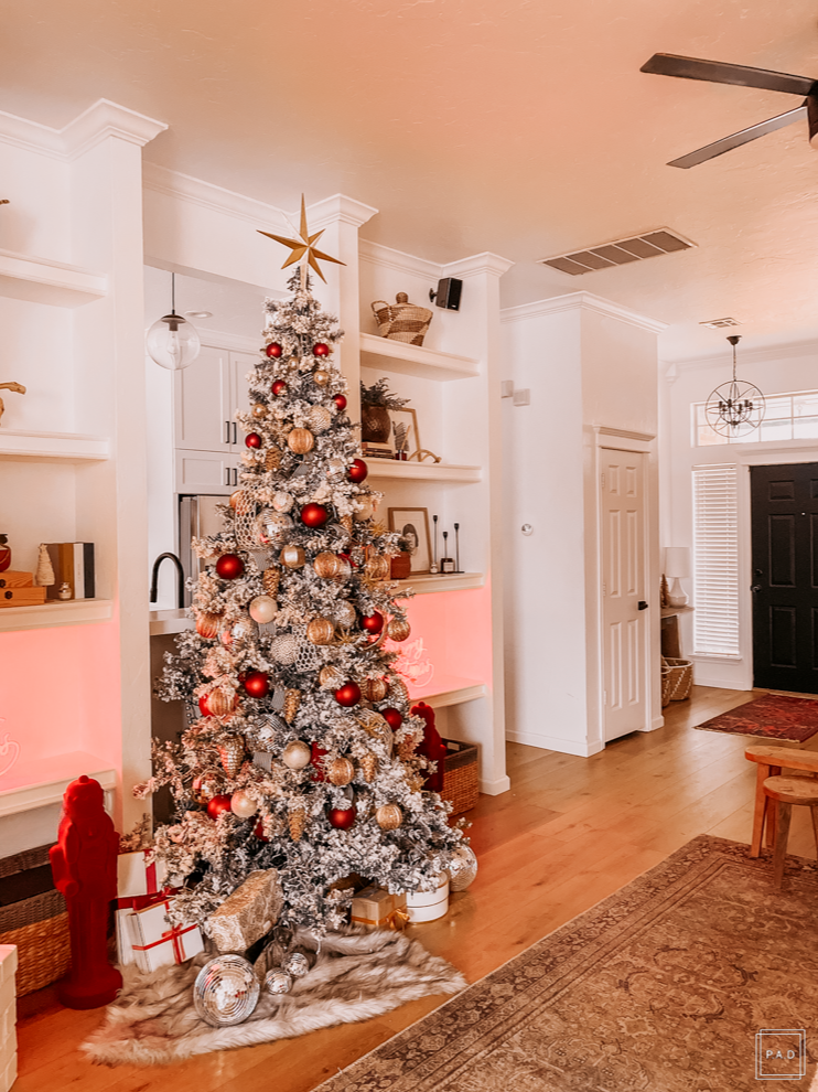 A Modern Christmas living room Decorated with a red neon Merry Christmas sign