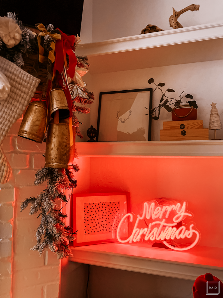 A Modern Christmas living room Decorated with a red neon Merry Christmas sign
