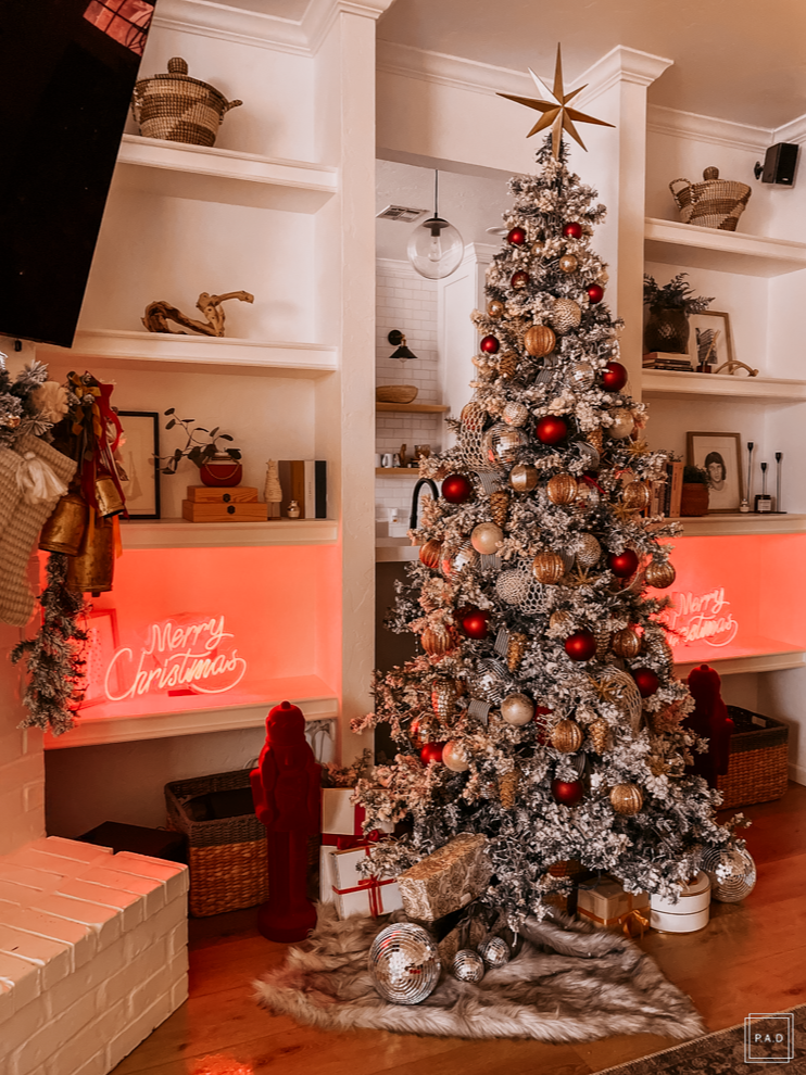 A Modern Christmas living room Decorated with a red neon Merry Christmas sign