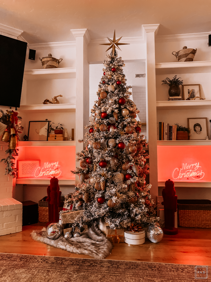 A Modern Christmas living room Decorated with a red neon Merry Christmas sign